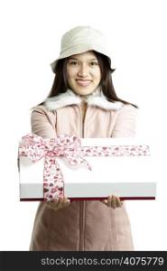 A woman carrying a gift box with pink ribbon