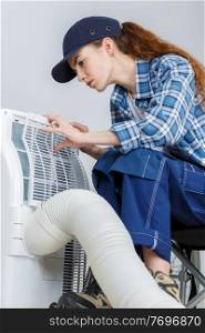 a woman checking the ventilation
