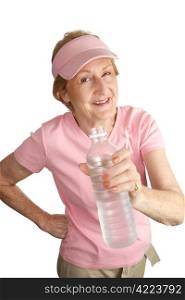 A woman dressed for breast cancer awareness holds out a bottle offering you some cold water. Isolated on white.