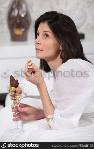 a woman eating Easter eggs