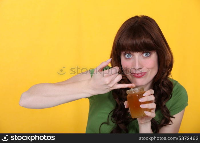 a woman eating jam