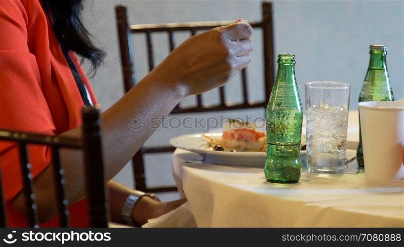 A woman eating lunch at a conference