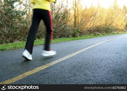 A woman exercising and running in the afternoon
