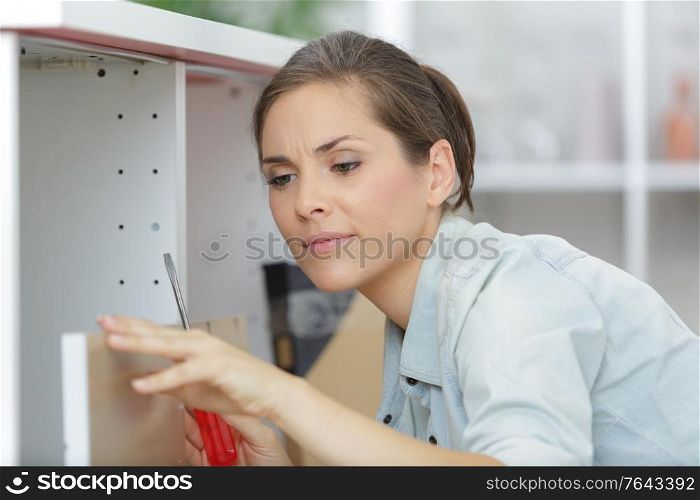 a woman fitting a furniture