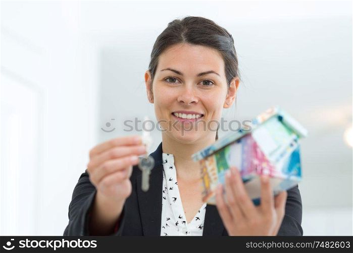 a woman giving house keys
