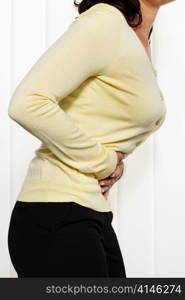 a woman has abdominal pain in the office. engages with the hands on the belly.