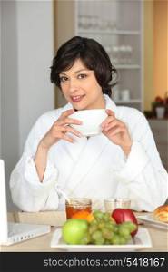 a woman having breakfast
