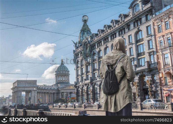 A woman in a hijab walks in St. Petersburg
