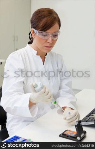 a woman in laboratory research. research in the research laboratory.
