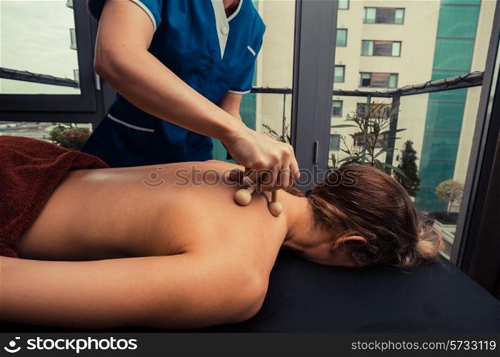 A woman is getting her back massaged