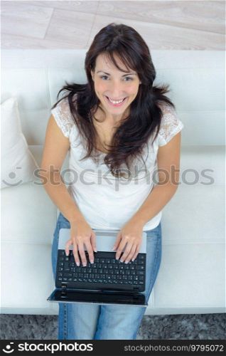 a woman is using laptop