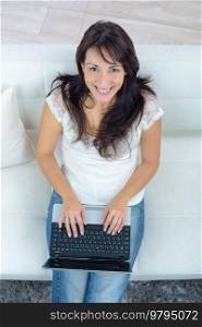 a woman is using laptop