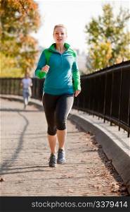 A woman jogging in a park
