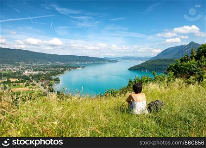 a woman looking a view of Annecy lake