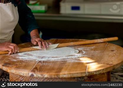 A woman making pancakes in Antalya, Turkey