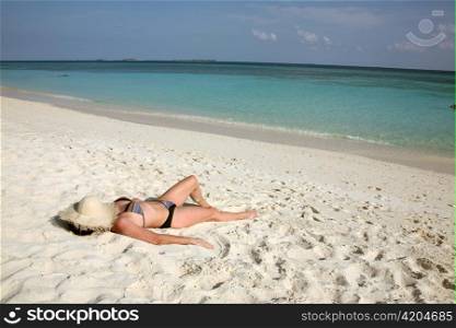 a woman on a dream beach. on vacation