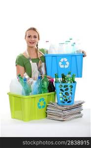 A woman recycling plastic bottles.
