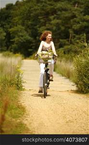 A woman riding a bike