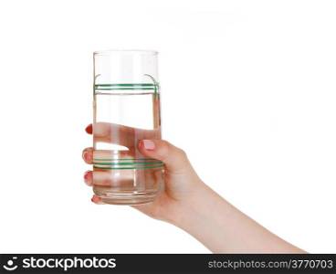 A woman&rsquo;s hand holding a glass of water, isolated for whitebackground.