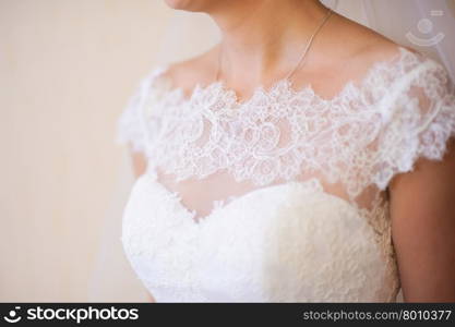 a woman&rsquo;s neck line on her wedding day.