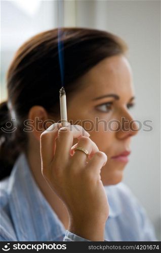 a woman smoking a cigarette
