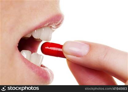a woman takes one tablet of the capsule. medical care drugs