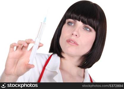 a woman taking a syringe