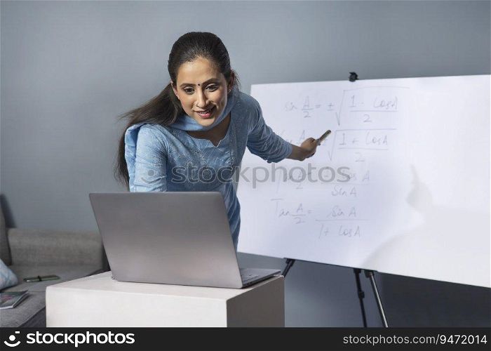 A woman teaching in an online class.