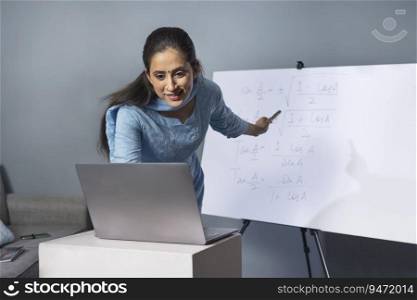 A woman teaching in an online class.