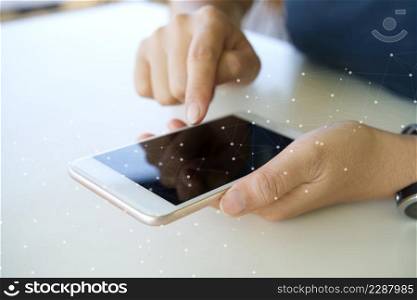 A woman uses a touchscreen smartphone to communicate. Doing business and connecting big data together with buying and selling in the online world At a coffee shop according to an urban lifestyle.