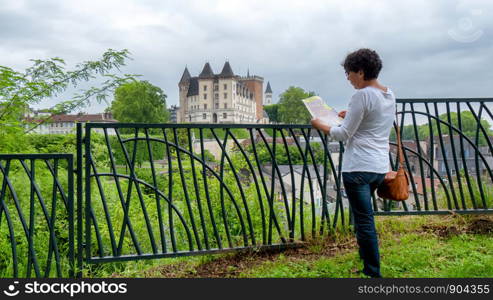 a woman visiting castle of Pau city in France