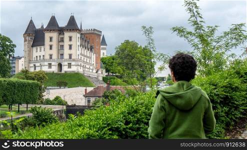 a woman visiting castle of Pau city in France