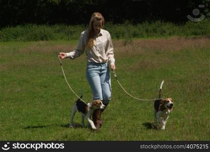 A woman walking puppies