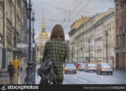 A woman walks around St. Petersburg. Russia