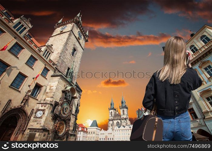 A woman walks in the evening in the center of Prague. Czech Republic