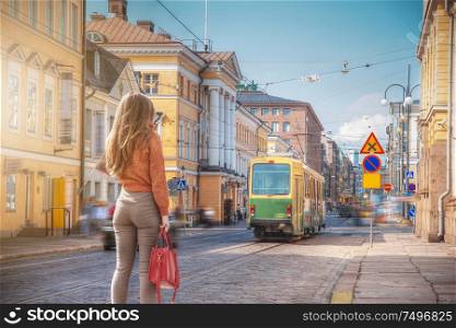 A woman walks through the center of Helsinki. Finland.