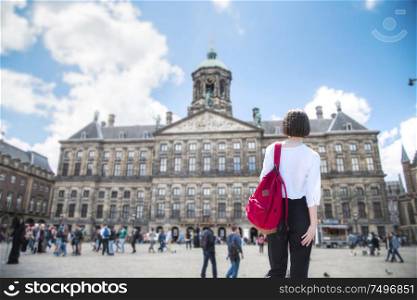 A woman walks through the streets of Amsterdam