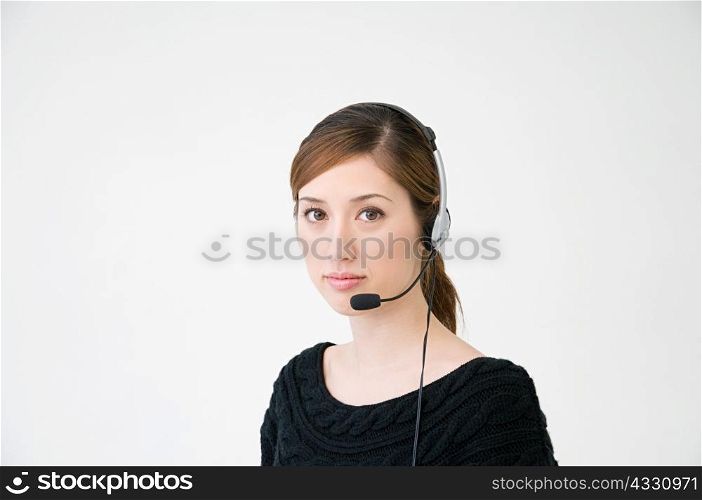 A woman wearing a telephone headset