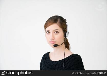 A woman wearing a telephone headset