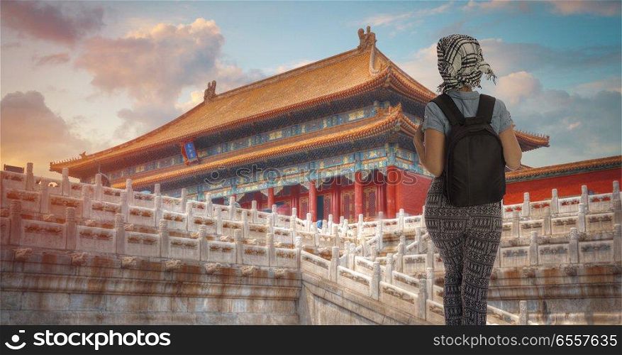 a woman with a backpack travels around Beijing. China.