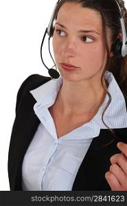 A woman with a headset on.