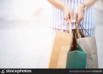 A woman with a shopping bag