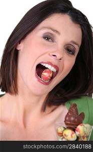a woman with an Easter egg in the mouth