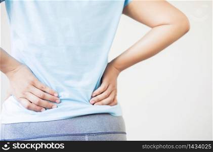 A woman with waist pain in the back