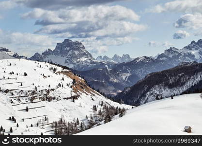 a wonderful view over the wide valleys and mountains of the Italian Dolomites in late winter . View over the wide valleys and mountains of the Italian Dolomites in late winter