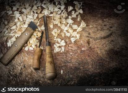 a wood carvings, tools and processes work closeup