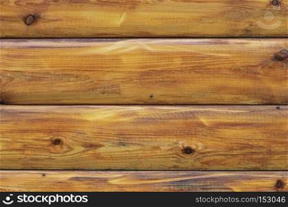 A Wooden background textured horisontal pattern in brown colors with logs