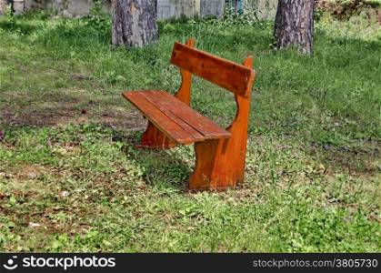 A wooden bench for rest in mountain yard, Rila mountain, Bulgaria