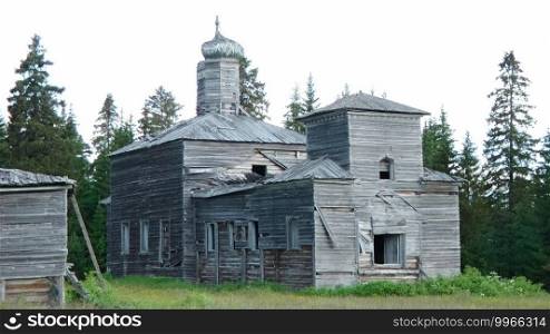 A wooden church in the summer on the edge of the forest.. wooden church in the summer on the edge of the forest.