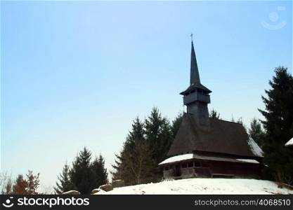 A Wooden Church with a tall Steeple, Sighet, Romania.